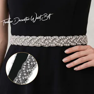 Close-up detail of luxury silver rhinestone bridal waist belt for formal dresses