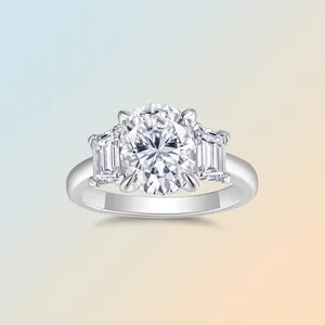 Classic sterling silver three-stone ring with oval Moissanite and baguette side diamonds