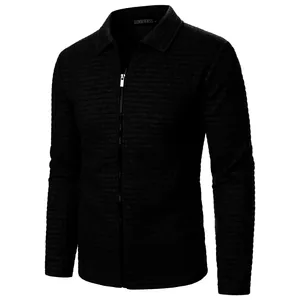 Close-up showing texture of men's black waffle knit zip-up jacket with lapel collar