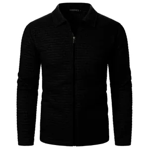 Detail view of black waffle-knit men's zip-up jacket featuring a textured checkered pattern