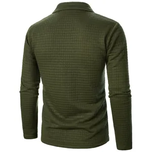 Detail view of the back of a men's olive green waffle grid textured long sleeve jacket.