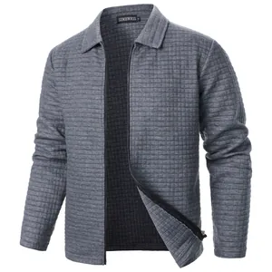 Macro view of grey waffle knit jacket showing grid textured fabric and sturdy zipper detail