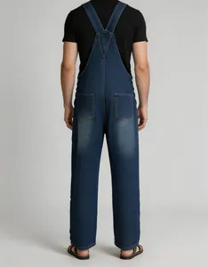 Rear view of classic blue denim overalls for men with adjustable straps.