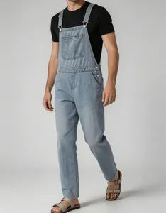 Side view detail of men's retro light blue denim overalls with adjustable straps