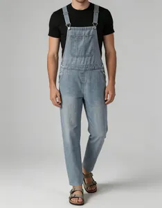 Detailed view of men's vintage light blue denim overalls with adjustable straps