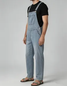 Side view of men's vintage light blue denim overalls with adjustable straps