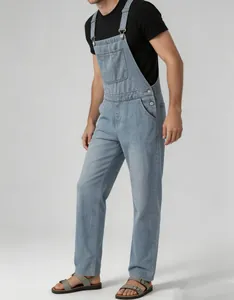 Detailed view of men's vintage light blue denim overalls with adjustable straps