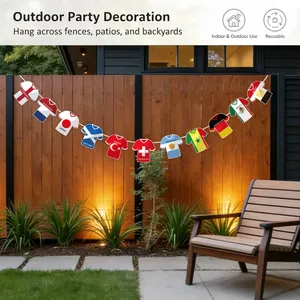Football jersey bunting banner hanging on a wooden garden fence for outdoor party