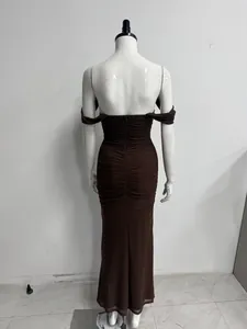 Back view of an elegant off-shoulder ruched mesh maxi dress in deep chocolate brown color