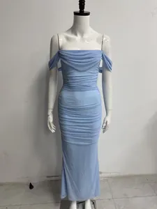 Detailed view of a light blue off-the-shoulder pleated mesh maxi dress on a mannequin