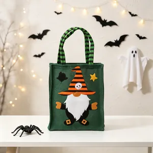 Detail of Halloween burlap tote bag featuring a gnome witch design with striped hat