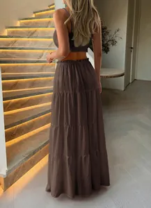 Elegant back view of a chocolate brown tiered maxi skirt and crop top resort set.