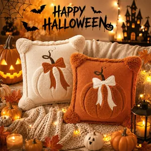 Cozy Halloween plush pumpkin cushions displayed in a festive warm candlelit setting