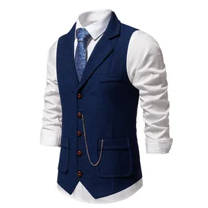 Detailed view of vintage blue herringbone waistcoat featuring lapel and gold chain