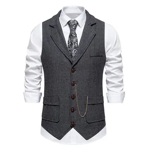 Detailed close-up view of a vintage men's herringbone tweed vest with lapel and chain