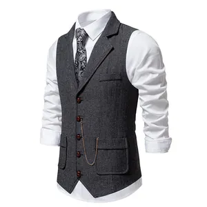 Detailed view of men's retro grey herringbone vest with lapel and pocket chain