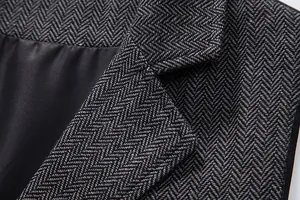 Macro view showing the detailed herringbone texture of this vintage men's suit vest