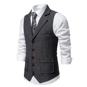 Vintage men's herringbone suit vest featuring a lapel collar and decorative gold chain