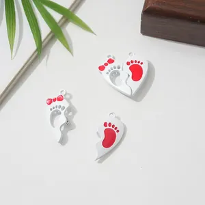 Magnetic heart-shaped split pendants with cute red footprint design for friendship
