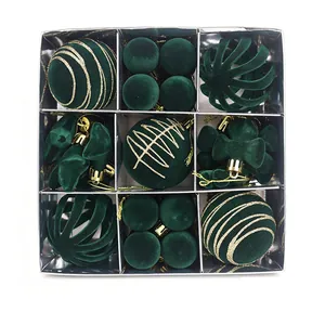 Dark green flocked Christmas ornaments set with gold patterns in a luxury silver gift box