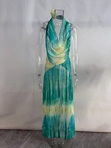Detailed front view of a deep V halter tie-dye beach maxi dress in teal and yellow