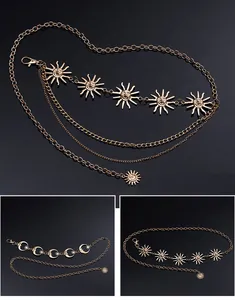Gold multi-layer metal waist chain featuring sun and moon celestial charms in detail view