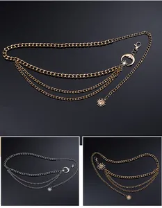 Detailed view of multi-layered gold and silver waist chain with sun and moon charms