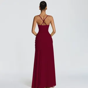 Detailed back view of an elegant burgundy pleated maxi dress with sexy cross backless straps