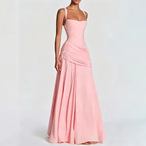 Elegant light pink floor-length maxi dress featuring a ruched bodice and spaghetti straps