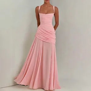 Elegant pink pleated evening gown detail showing draped fabric and slim fit