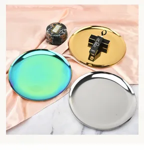 Nordic style metal round storage trays in gold, silver, and iridescent finishes.