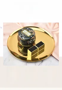 Elegant gold round metal tray for jewelry and cosmetic storage, Nordic style