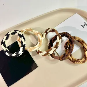 Set of 5 stylish braided rope hair ties in neutral autumn brown and black colors
