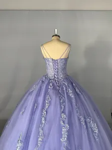 Detailed back view of a lavender tulle ball gown with elegant corset lace-up design