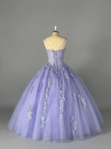 Detailed back view of a lavender tulle ball gown with elegant corset lace-up design