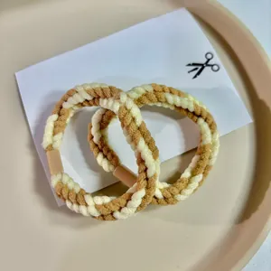 Set of two high-quality brown and cream braided twist hair ties for autumn fashion