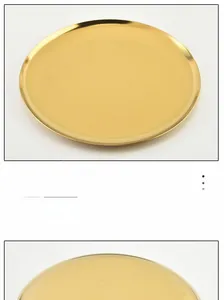 Detailed view of a minimalist golden round metal tray for jewelry and vanity storage