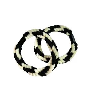 Set of two black and white braided twisted hair ropes for elegant women's hairstyling
