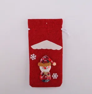 Detailed front view of a red Christmas burlap wine bottle bag with 3D snowman decor