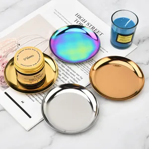 Top view of metallic round trays in gold, silver, and rainbow finishes for jewelry