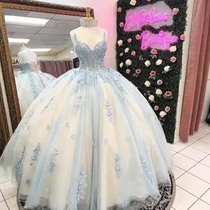 Elegant light blue ball gown featuring a beaded bodice and tiered tulle princess skirt.