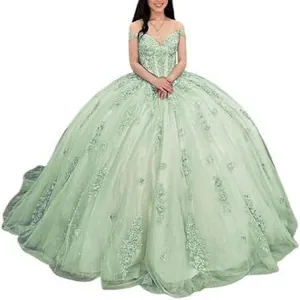 Elegant sage green off-the-shoulder ball gown with lace appliques and tulle skirt.
