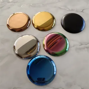 Detailed view of circular metal jewelry trays in six different polished metallic finishes