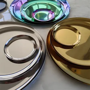 Close-up of multicolored stainless steel round storage trays in gold, silver and rainbow