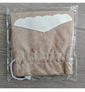 Decorative Christmas burlap wine bottle bag with felt beard detail in clear wrap