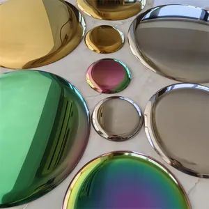 Detailed view of assorted Nordic style round metal trays in vibrant reflective finishes
