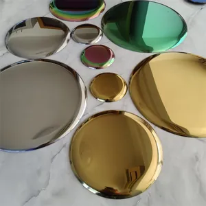 Detailed top view of colorful Nordic metal round trays with shiny mirror finish