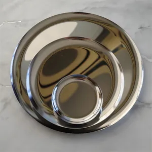 Set of three professional nesting stainless steel round trays with polished metallic finish
