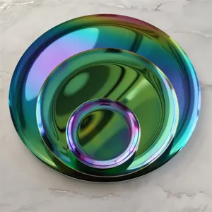 Detailed top view of three iridescent circular metal trays for jewelry storage.