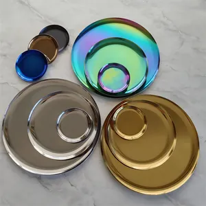 Set of Nordic stainless steel round trays in multiple colors and sizes on marble background